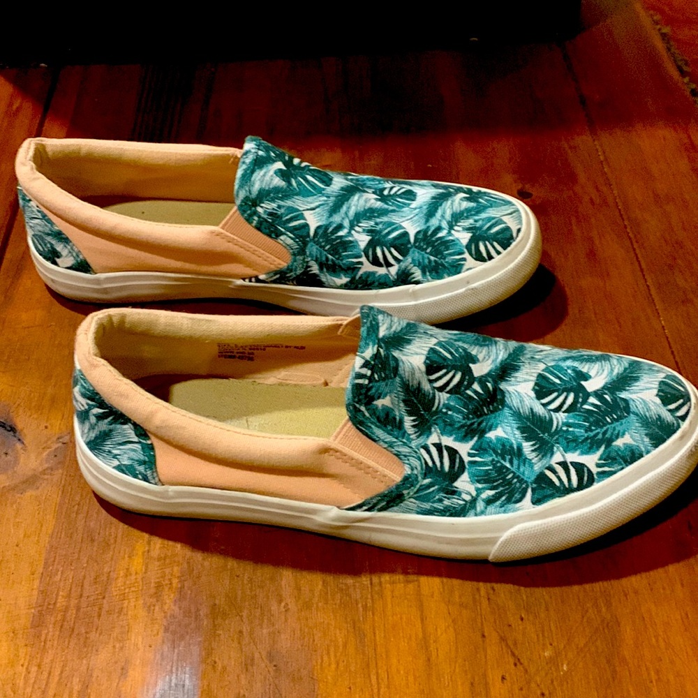 Slip on sneakers, decorative green leaf. Gently worn